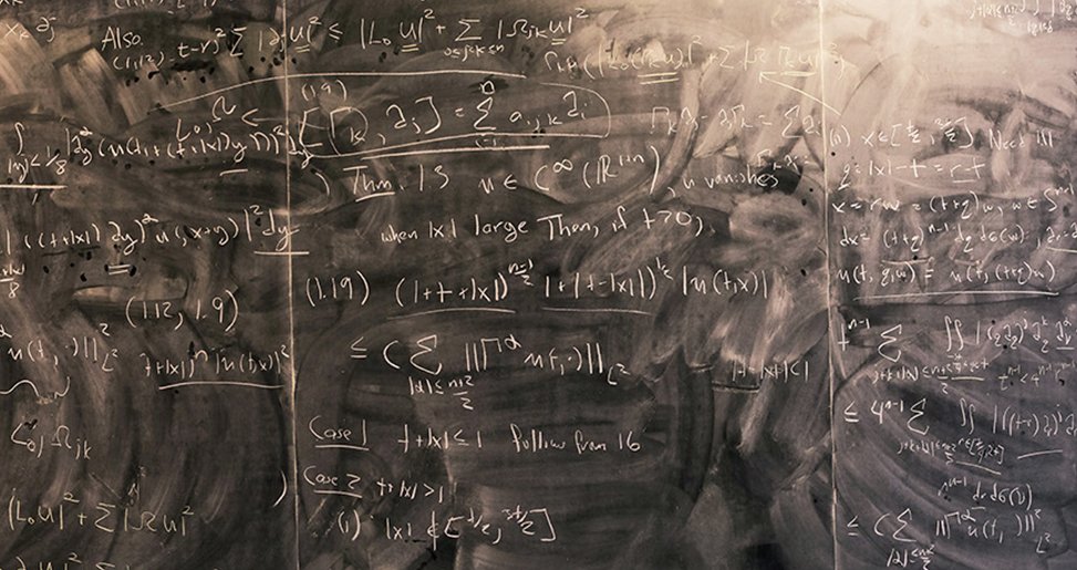 Mathematical equations on a chalkboard.
